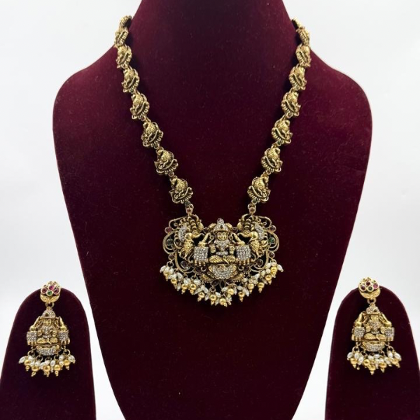Grand Goddess Temple Necklace Set with AD Stones & Antique Gold Finish