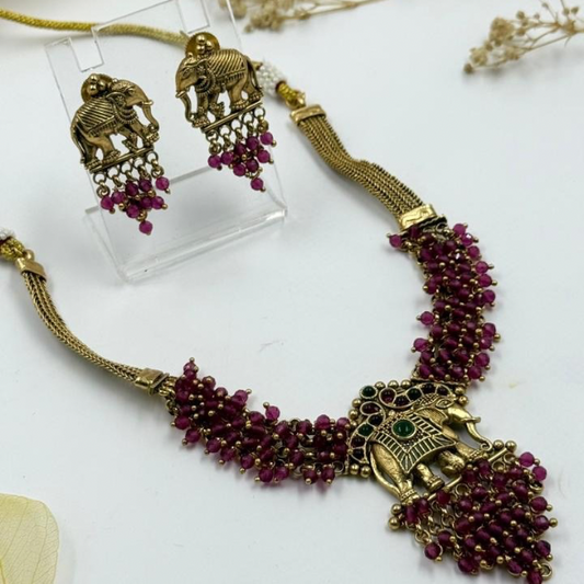 Radiant Elephant: Red Bead Necklace and Earrings Set