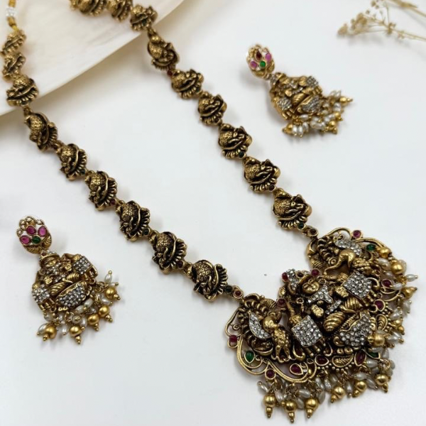 Grand Goddess Temple Necklace Set with AD Stones & Antique Gold Finish