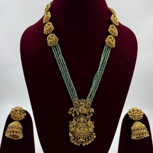 Kanchana Gold Temple Set – Adorned with Emerald Hues & Jhumkas