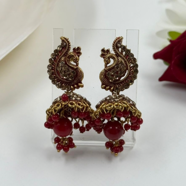Peacock Plume: Ruby Red & Antique Finish Jhumka Earrings