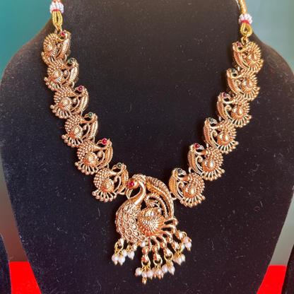 Peacock Majesty: Gold-Colored Necklace and Earrings Set