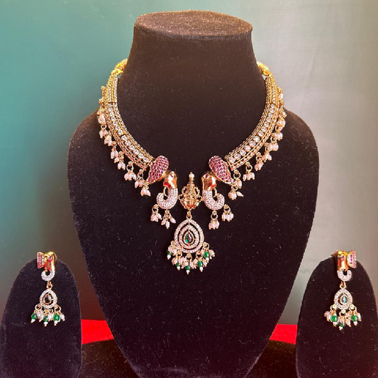 Royal Heritage: Gold-Toned Necklace and Earrings Set with Peacock Motif